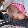 Katy participe au concours pour gagner de l'argent avec cette photo : baby, child, face, tongue_out, hood, pink_headband, polka_dot, closeup, cute, warm_clothing, jacket, outdoor, smiling, infant, person, babywearing, soft_texture, eyeshine, playful, portrait