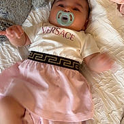 Amira joined the competition — help win amazing prizes! baby, pacifier, blanket, plush_toy, clothing, pink_skirt, white_shirt, infant, bed, soft_toys, cute, sleepwear, child, lying_down, indoor, fabric, comfort, small_child, motion_blur, versace