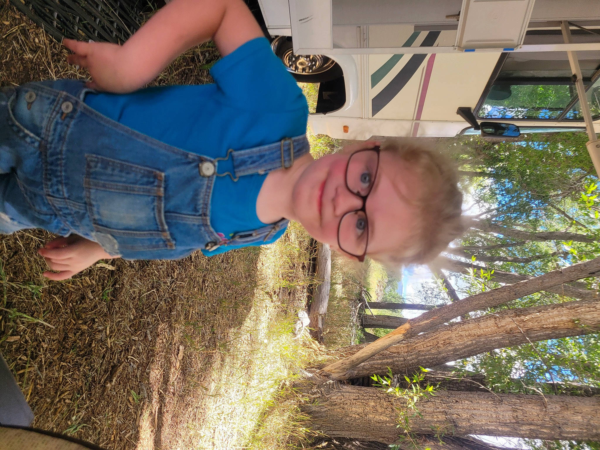 Elora is registered to the contest to win money with this photo: child, denim, electric_blue, fun, grass, happy, human_leg, joy, leisure, people, people_in_nature, person, plant, smile, soil, t_shirt, thigh, tree, vacation, waist