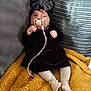 Mekltiè-Lee is registered to the contest to win money with this photo: baby, pacifier, black_dress, headband, bow, blanket, couch, sock, pink_beads, child, infant, indoor, cute, portrait, cozy, furniture, relaxed, small_hands, expression, soft_lighting