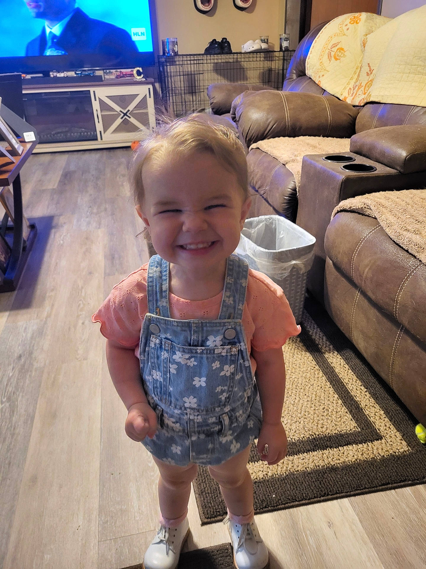 Tylee joined the competition — help win amazing prizes! blue, child, clothing, couch, floor, flooring, fun, happy, joy, leg, leisure, people, person, shorts, smile, standing, t_shirt, television, television_set, toddler