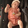 adorable, baby, car_seat, child, clothing, cute, face, hands, headband, indoor, infant, legs, peaceful, person, portrait, resting, romper, seatbelt, sleeping, soft_lighting