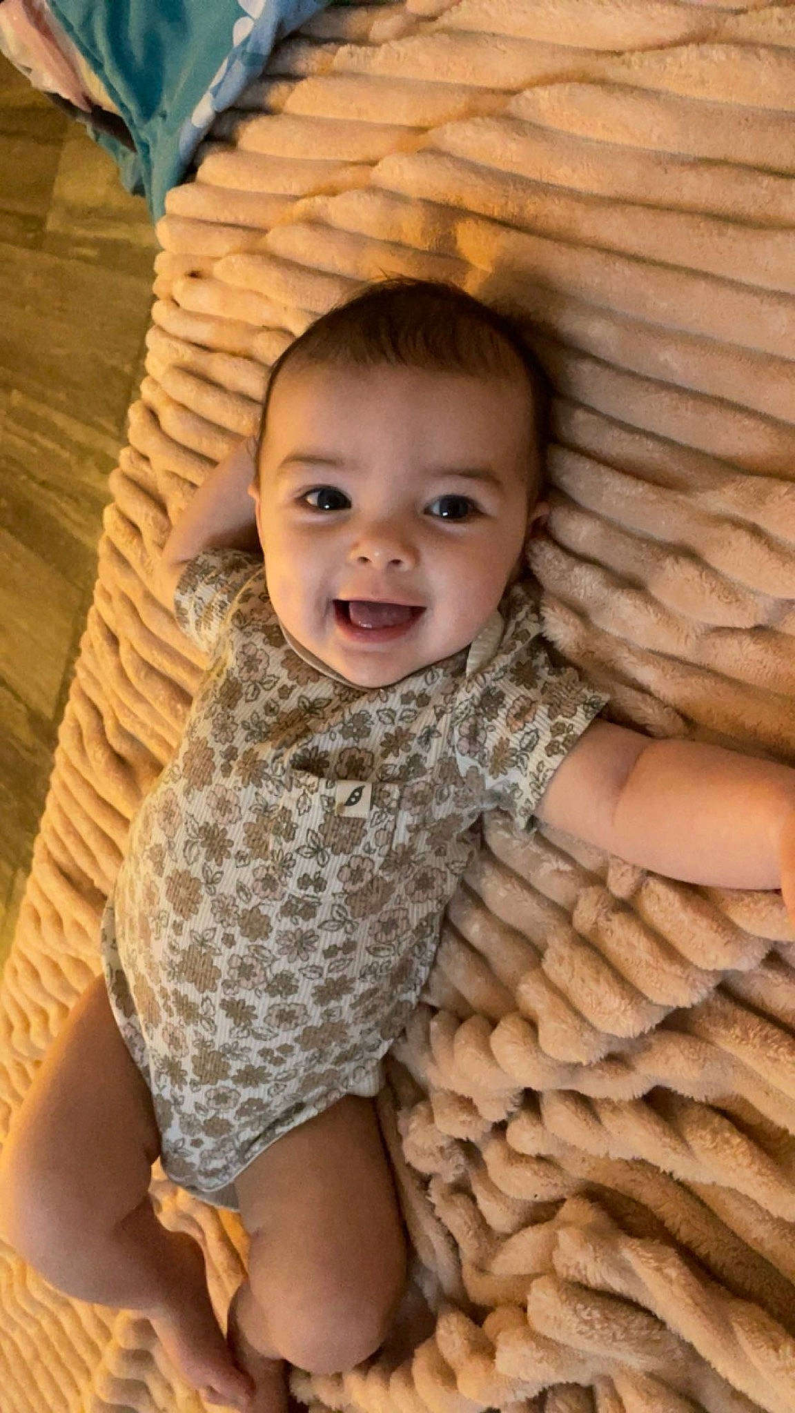 Richelle joined the competition — help win amazing prizes! baby, child, eye, flooring, fun, happy, head, human, mammal, pattern, person, shawl, sitting, skin, sleeve, smile, toddler, trunk, vertebrate, wood