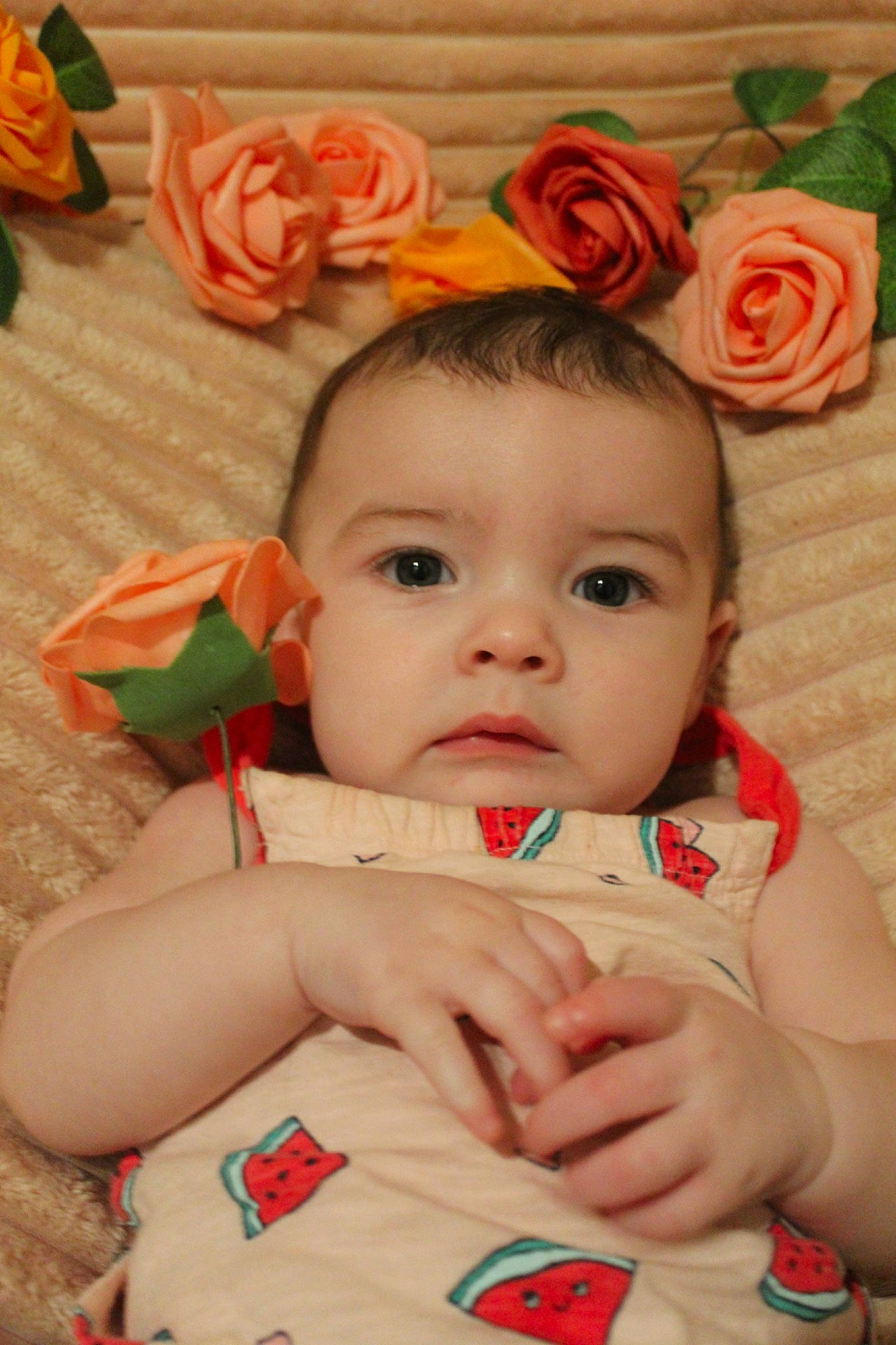 Richelle is registered to the contest to win money with this photo: baby, baby_toddler_clothing, cheek, chin, dress, eye, face, facial_expression, flower, happy, head, iris, lip, mouth, orange, person, petal, pink, skin, textile