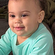 Kynzlee joined the competition — help win amazing prizes! baby, child, face, hair_ties, pink, mint_green_clothing, long_sleeves, curly_hair, smiling, indoors, portrait, cute, young_child, happy, skin, eyes, person, infant, cozy, texture