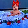 baby, background, child, curious, cute, flower, flower_arrangement, flower_petals, greenery, headband, infant, nature, outdoor, portrait, red_bow, roses, sitting, skin, tub, white_cloth