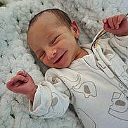 Hope participe au concours pour gagner de l'argent avec cette photo : baby, blanket, child, clothing, cozy, cute, fabric, face, fingers, hand, infant, newborn, pattern, peaceful, portrait, resting, sleeping, smiling, soft, white