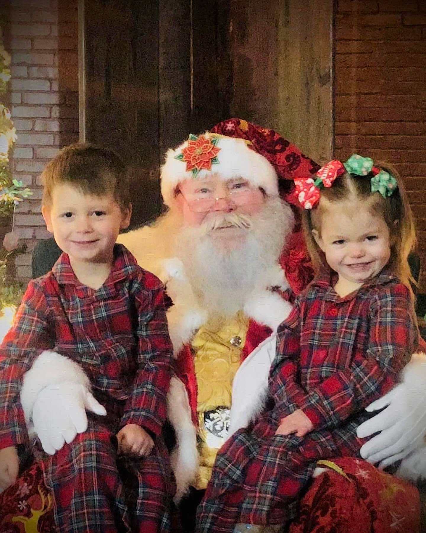 Grayson is registered to the contest to win money with this photo: beard, child, christmas, christmas_eve, event, facial_hair, fictional_character, fun, fur, green, happy, hat, headwear, holiday, joy, lap, pattern, person, plaid, santa_claus