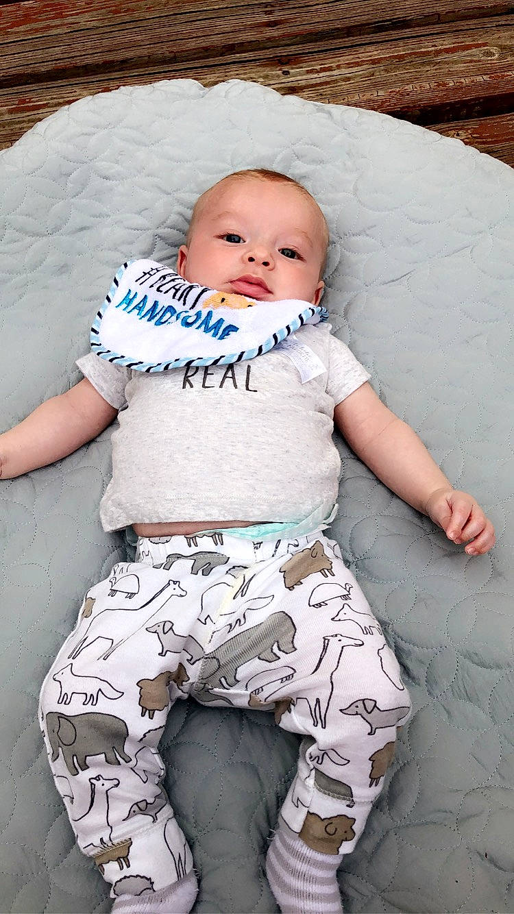 Cillian is registered to the contest to win money with this photo: baby, baby_toddler_clothing, cheek, child, comfort, eye, happy, head, human_body, leg, mouth, pattern, person, pink, skin, sleeve, t_shirt, textile, thigh, toddler