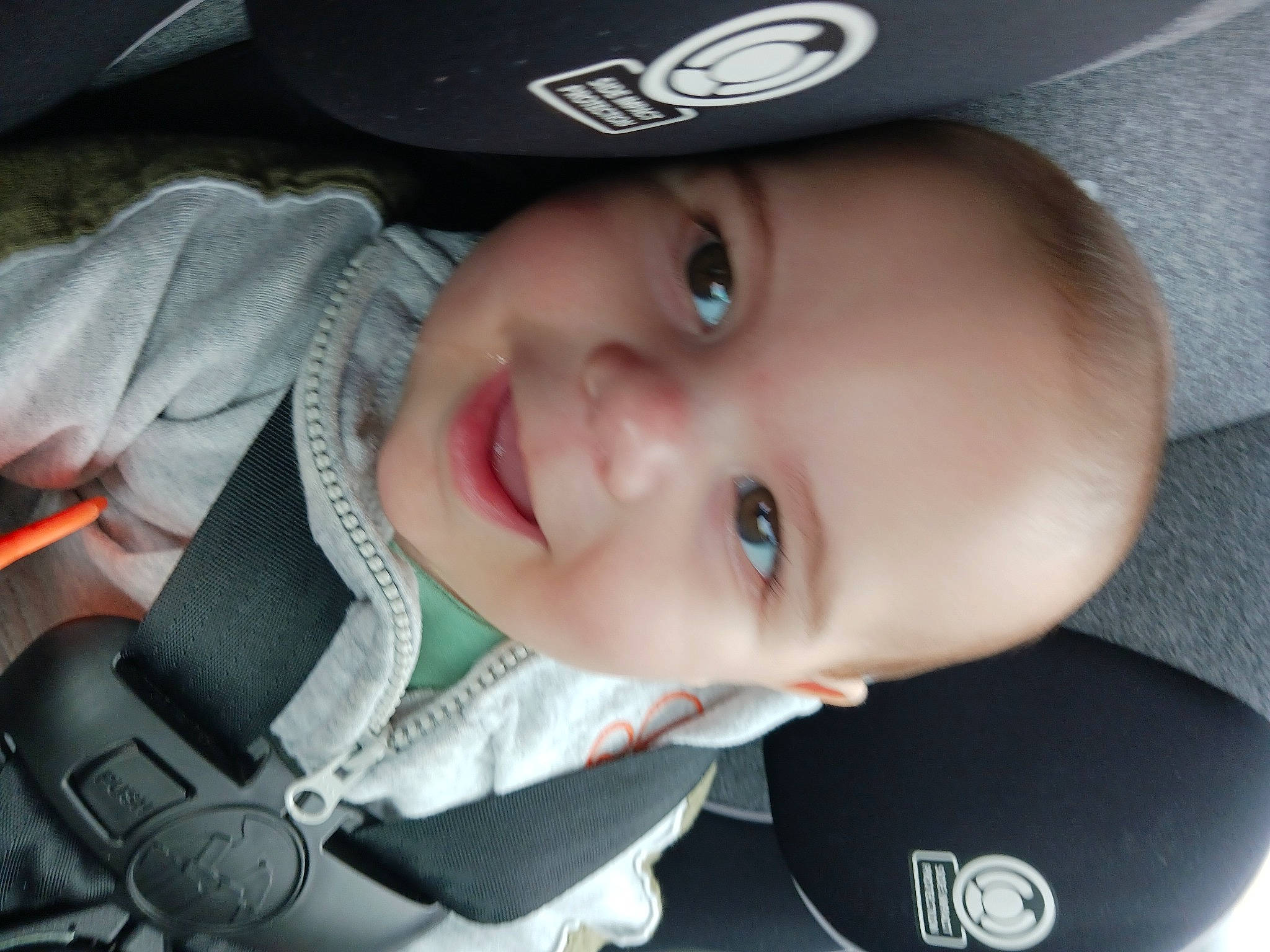 Lucas joined the competition — help win amazing prizes! baby, baby_products, baseball_cap, cap, car_seat, cheek, child, electric_blue, eyebrow, eyelash, fashion_accessory, flash_photography, fun, hat, iris, joy, lip, nose, person, smile