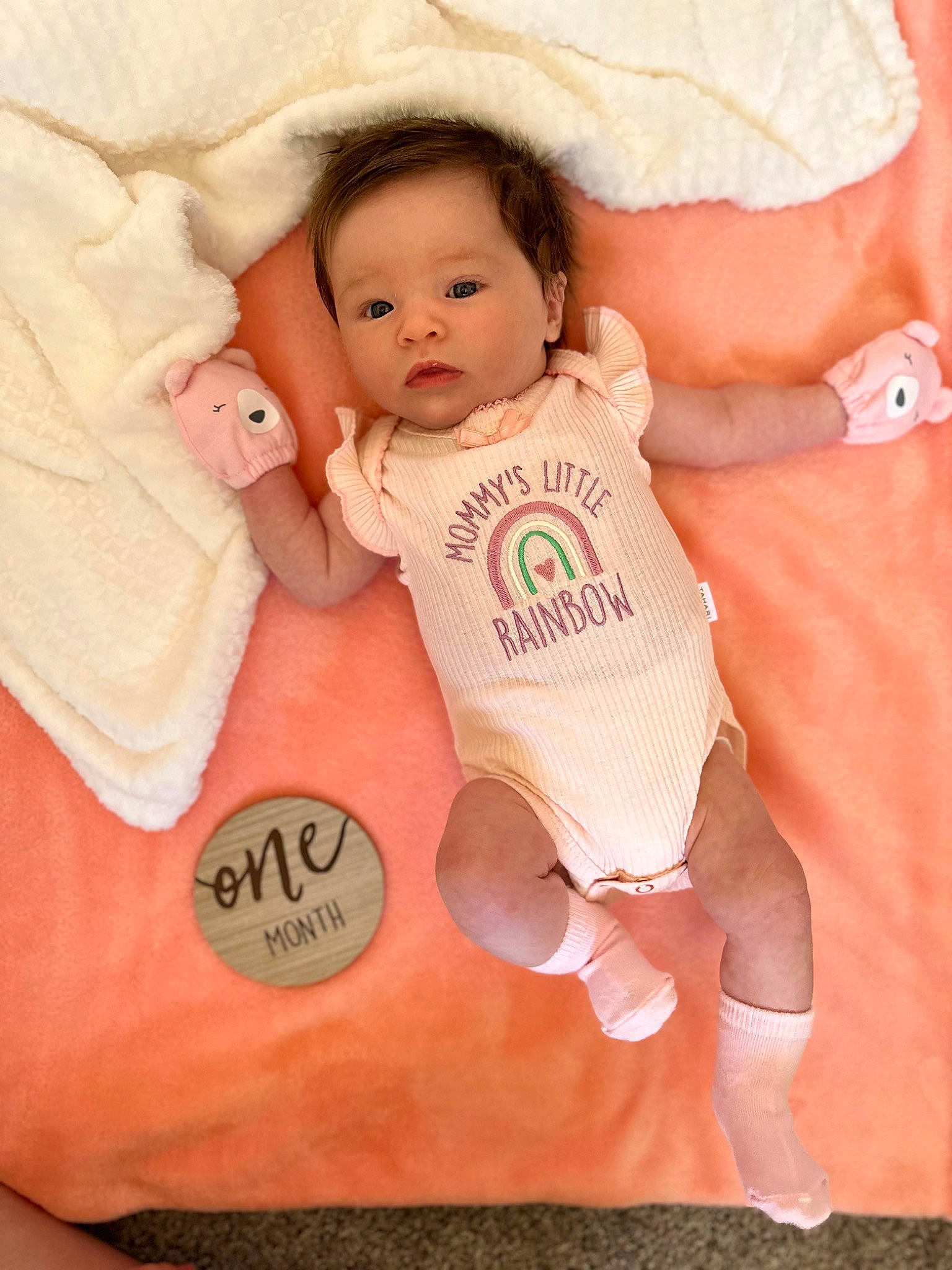 Peyton is registered to the contest to win money with this photo: baby, baby_products, baby_safety, baby_sleeping, baby_toddler_clothing, bedding, cheek, child, comfort, eye, finger, gesture, happy, linens, neck, person, pink, sleeve, t_shirt, thumb
