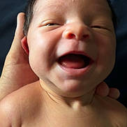 Tova is registered to the contest to win money with this photo: baby, newborn, smiling, face, hand, skin, close_up, infant, portrait, happiness, cute, child, human, expression, mouth, head, shoulder, person, young, love