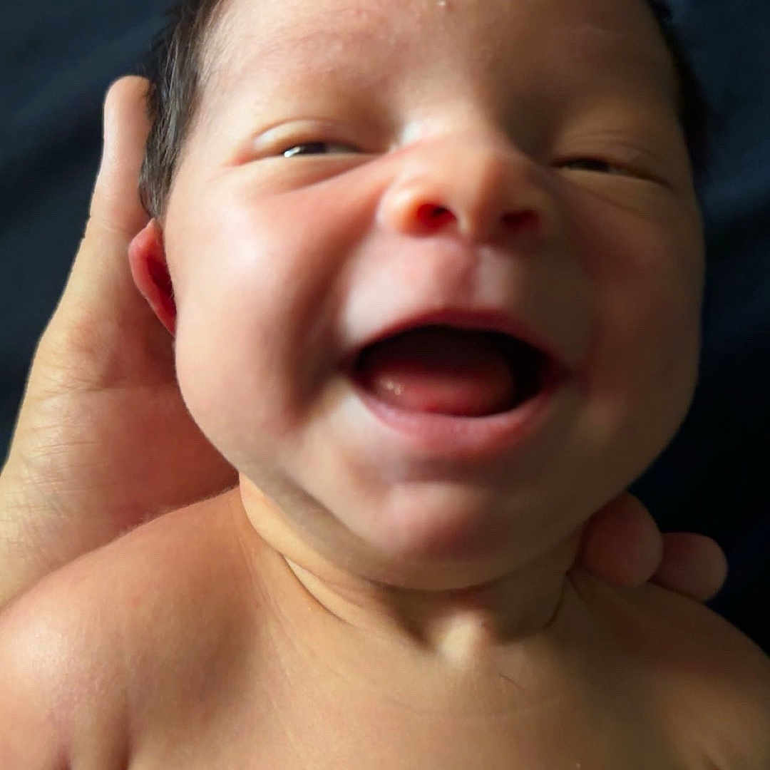 Tova is registered to the contest to win money with this photo: baby, child, close_up, cute, expression, face, hand, happiness, head, human, infant, love, mouth, newborn, person, portrait, shoulder, skin, smiling, young