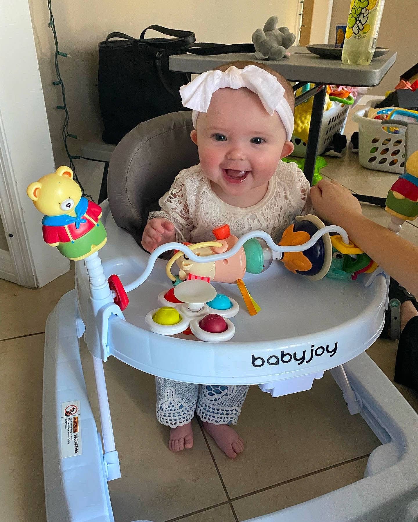 Addison is registered to the contest to win money with this photo: baby, baby_products, baby_safety, baby_toddler_clothing, baby_toys, chair, child, circle, comfort, fun, happy, headwear, person, plastic, play, room, sitting, smile, stuffed_toy, t_shirt