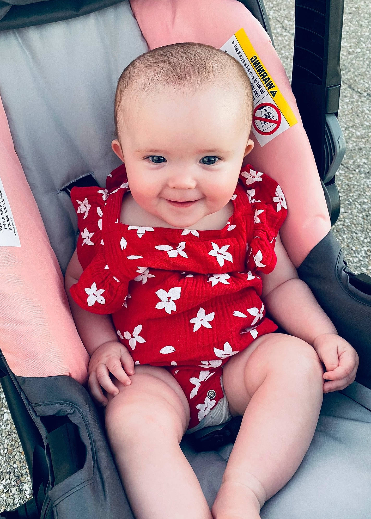 Addison is registered to the contest to win money with this photo: baby_toddler_clothing, cheek, child, comfort, facial_expression, finger, fun, hand, happy, head, joint, joy, lap, leg, person, pink, purple, skin, sleeve, smile