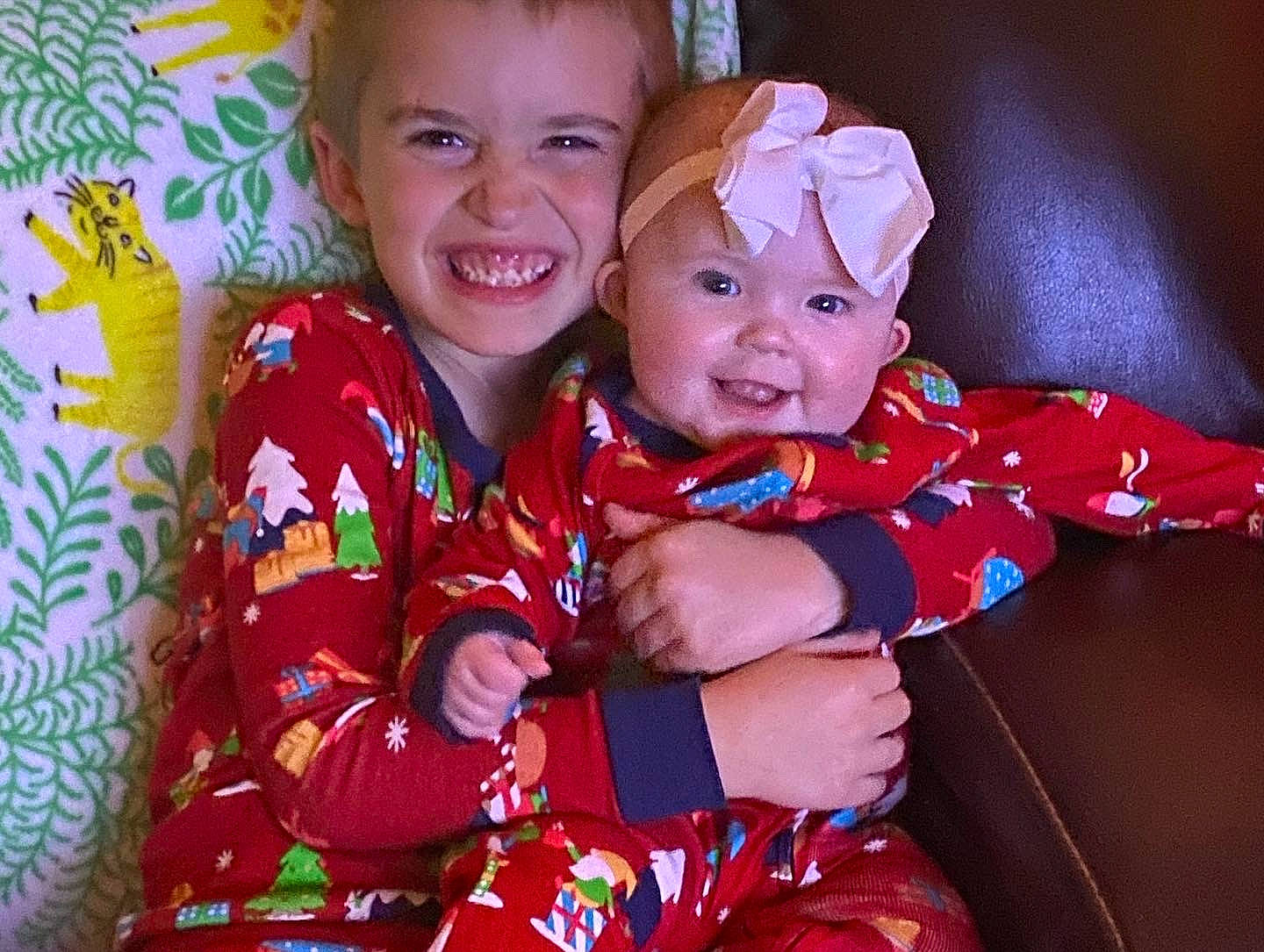 Addison is registered to the contest to win money with this photo: baby, baby_toddler_clothing, cheek, child, event, eye, face, finger, fun, gesture, happy, head, headwear, joy, magenta, organ, pattern, person, sleeve, smile