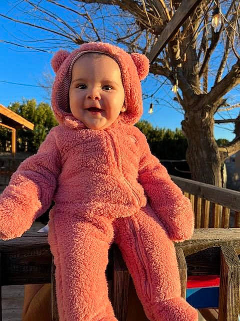Maya joined the competition — help win amazing prizes! baby, baby_toddler_clothing, child, fun, happy, hat, leisure, magenta, peach, people_in_nature, person, pink, sitting, sky, sleeve, smile, standing, toddler, tree, wool