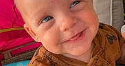 Huxton is registered to the contest to win money with this photo: baby, bodypart, clothing, cushion, face, furniture, grass, happy, head, homedecor, laughing, mouth, outdoors, pants, person, photography, plant, portrait, smile, tree