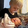 Raelynn joined the competition — help win amazing prizes! toddler, newborn, baby, pacifier, feeding_bottle, milk, hand, indoor, family, caring, smile, clothing, bed, blanket, person, closeup, infant, holding, child, love