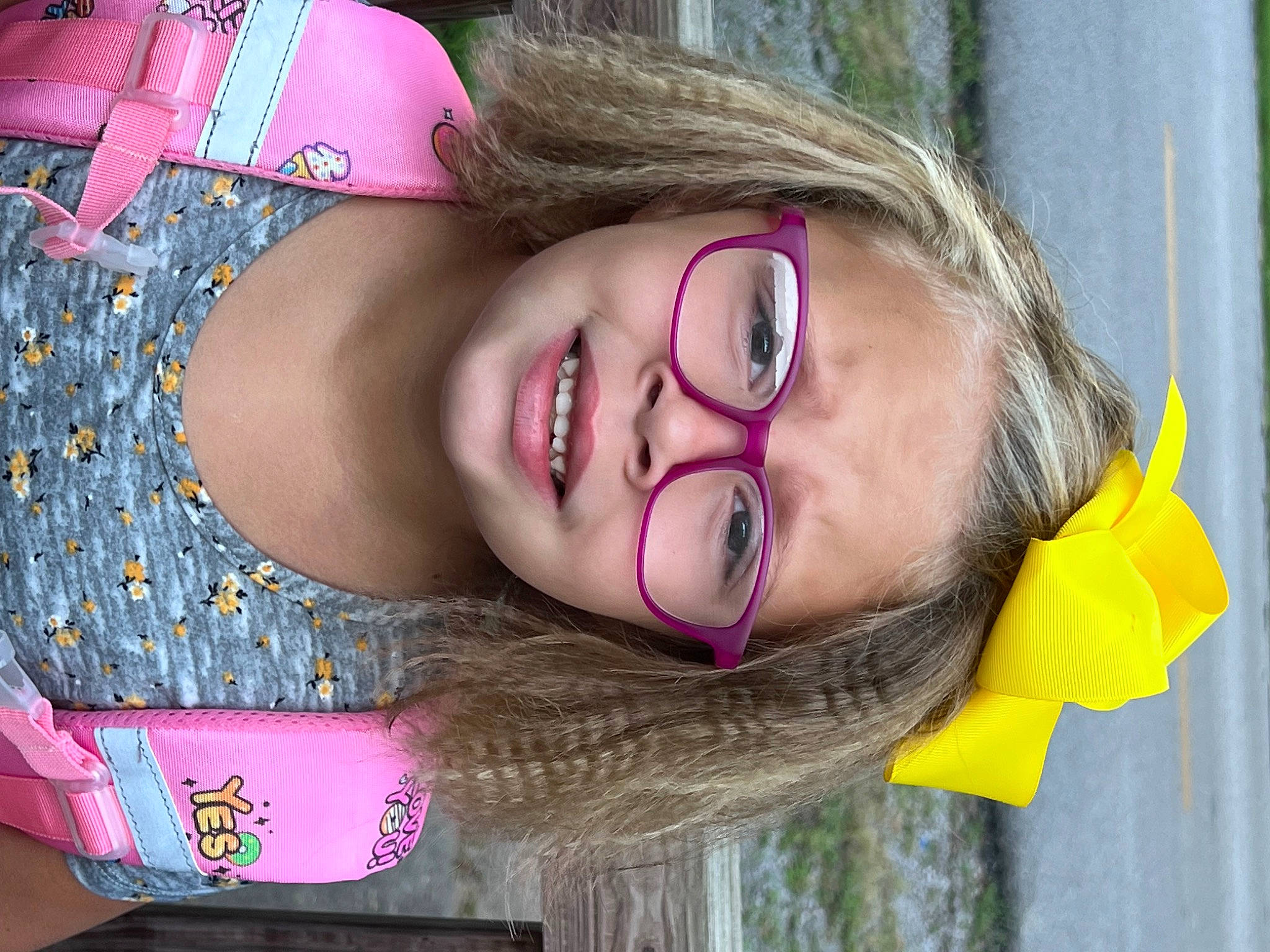 Ava is registered to the contest to win money with this photo: cheek, chin, cool, eyebrow, eyelash, eyewear, fun, glasses, happy, iris, lip, mouth, neck, nose, person, pink, plant, skin, smile, tree