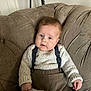 Coby joined the competition — help win amazing prizes! baby, child, sweater, suspenders, armchair, plush, brown, knitwear, cute, portrait, indoor, comfortable, cozy, furniture, person, young_child, blue_eyes, hand, seated, casual