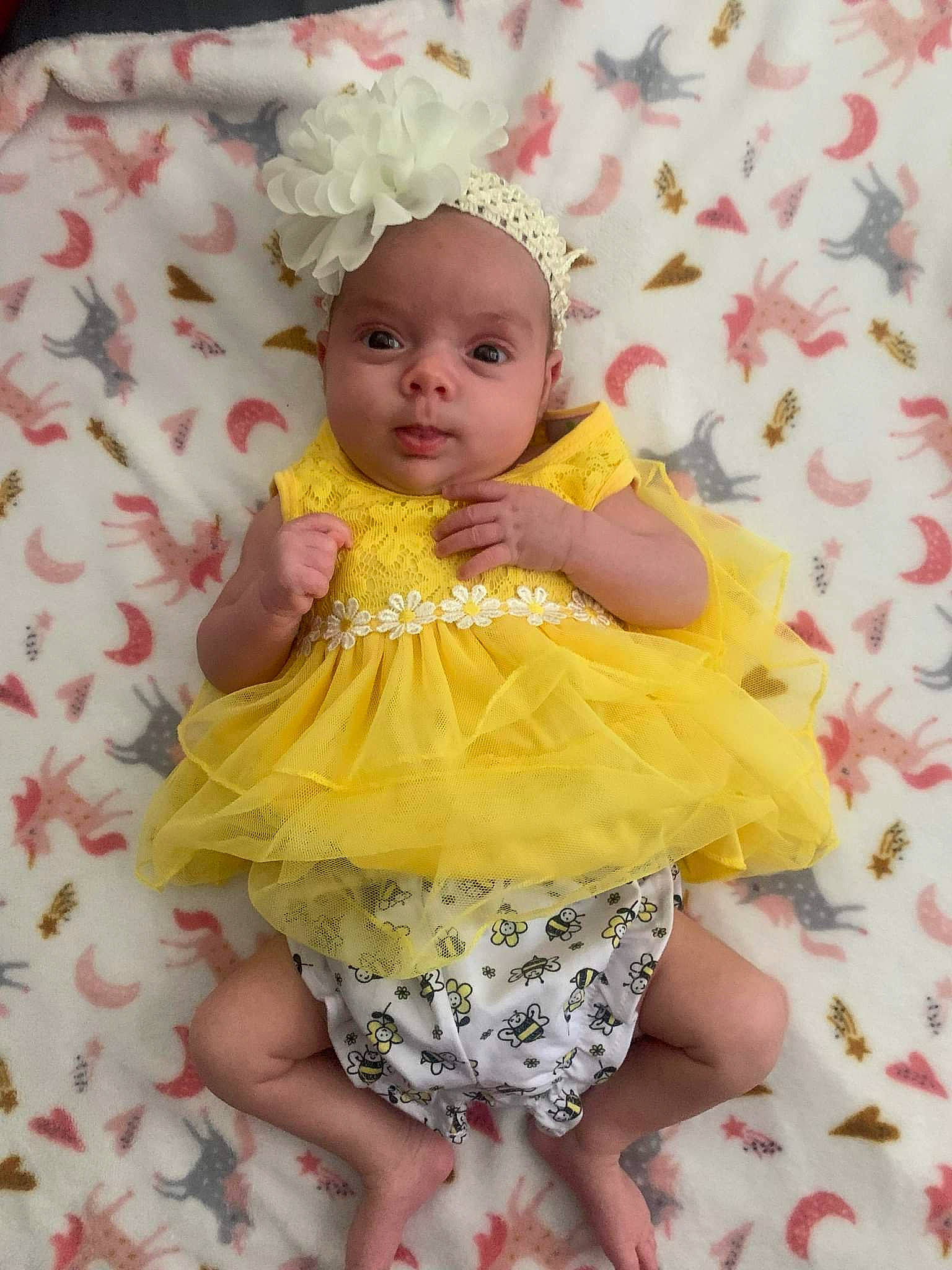 Skye is registered to the contest to win money with this photo: baby, baby_toddler_clothing, cheek, child, day_dress, dress, embellishment, eye, face, happy, head, iris, magenta, one_piece_garment, pattern, person, pink, skin, sleeve, textile