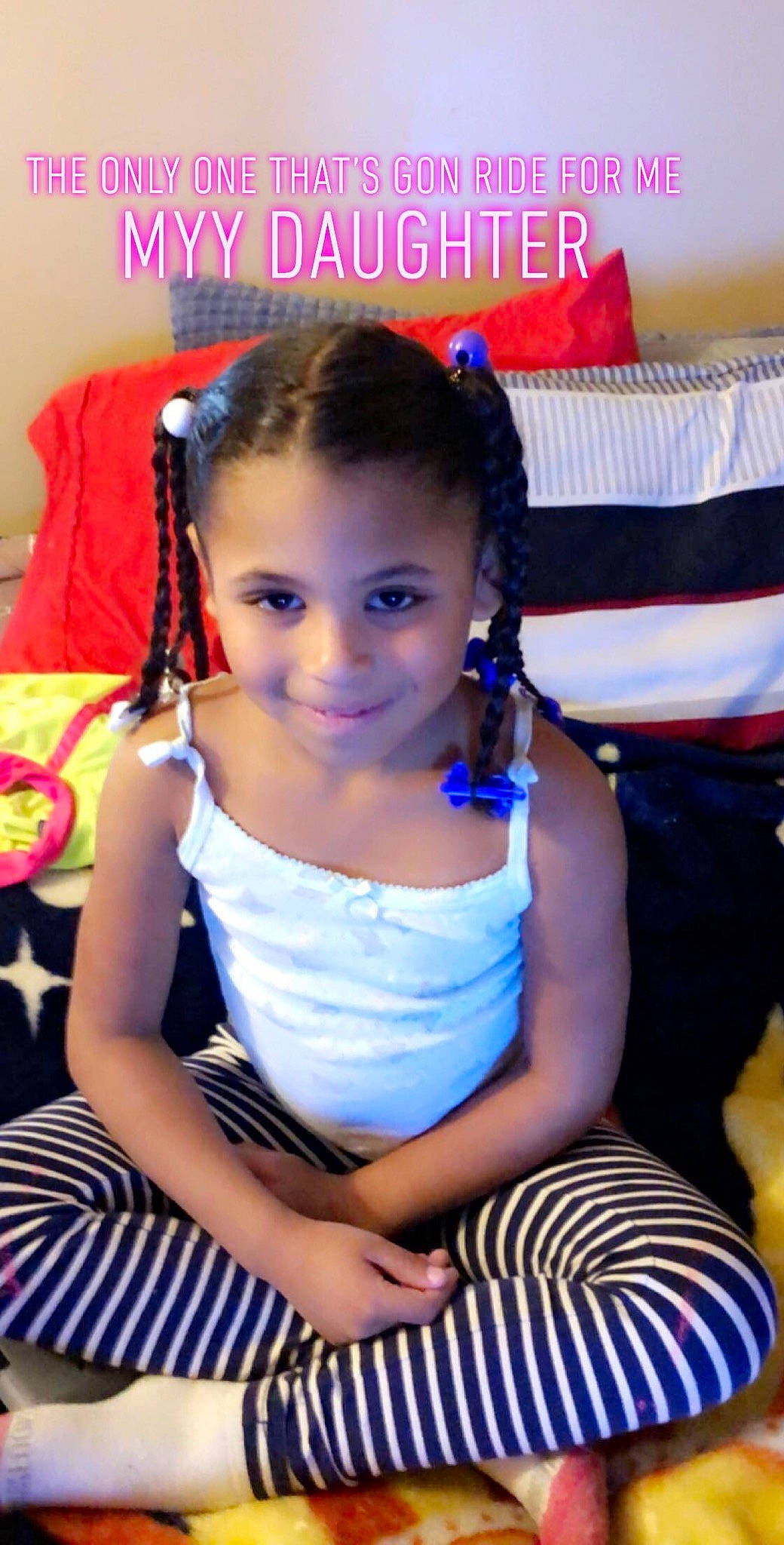 Armani is registered to the contest to win money with this photo: black_hair, cheek, child, ear, finger, furniture, hair, hairstyle, joy, person, photo_caption, play, sitting, smile, toddler