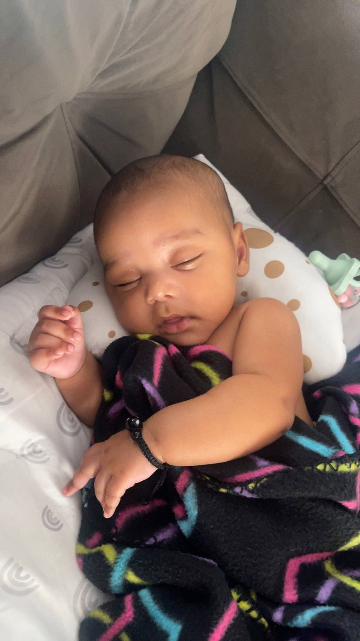 Kataleya is registered to the contest to win money with this photo: baby, baby_toddler_clothing, bed, cheek, child, comfort, eye, finger, fun, gesture, happy, head, mouth, nail, nose, person, pink, skin, thumb, toddler