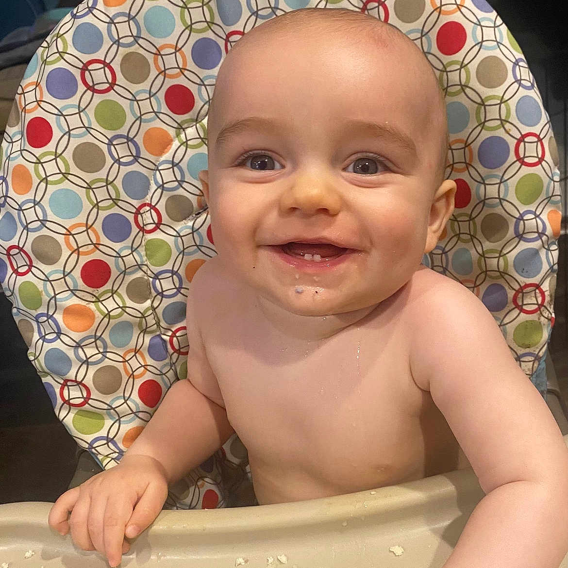 John Thomas is registered to the contest to win money with this photo: baby, bare_chested, child, colorful, crumbs, eyes, face, food, hands, happy, high_chair, home, indoor, infant, photography, polka_dot, portrait, sitting, smiling, tray