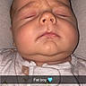 John Thomas joined the competition — help win amazing prizes! baby, blanket, chubby, close_up, clothing, cozy, cute, eyes_closed, face, head, heart_emoji, indoors, infant, onesie, photograph, portrait, resting, skin, sleeping, text_overlay