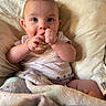 Rj is registered to the contest to win money with this photo: baby, biting, blanket, bodypart, couch, cutlery, eating, face, finger, food, furniture, hand, head, newborn, person, photography, portrait, spoon