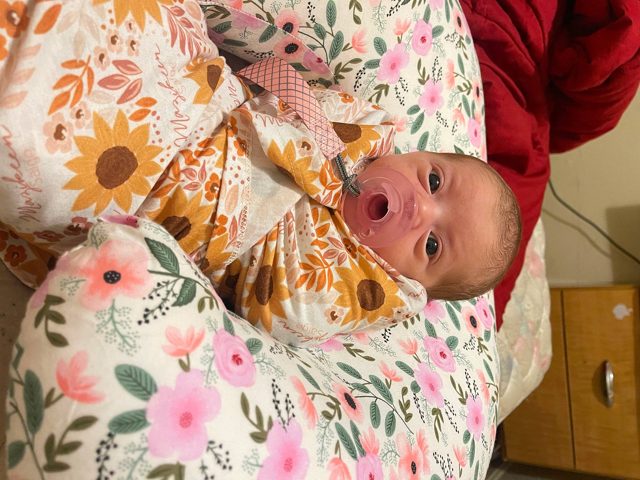 Mazikeen is registered to the contest to win money with this photo: baby, baby_toddler_clothing, cheek, child, comfort, door, eye, human_body, linens, mammal, orange, pattern, peach, person, pink, room, skin, sleeve, textile, toddler