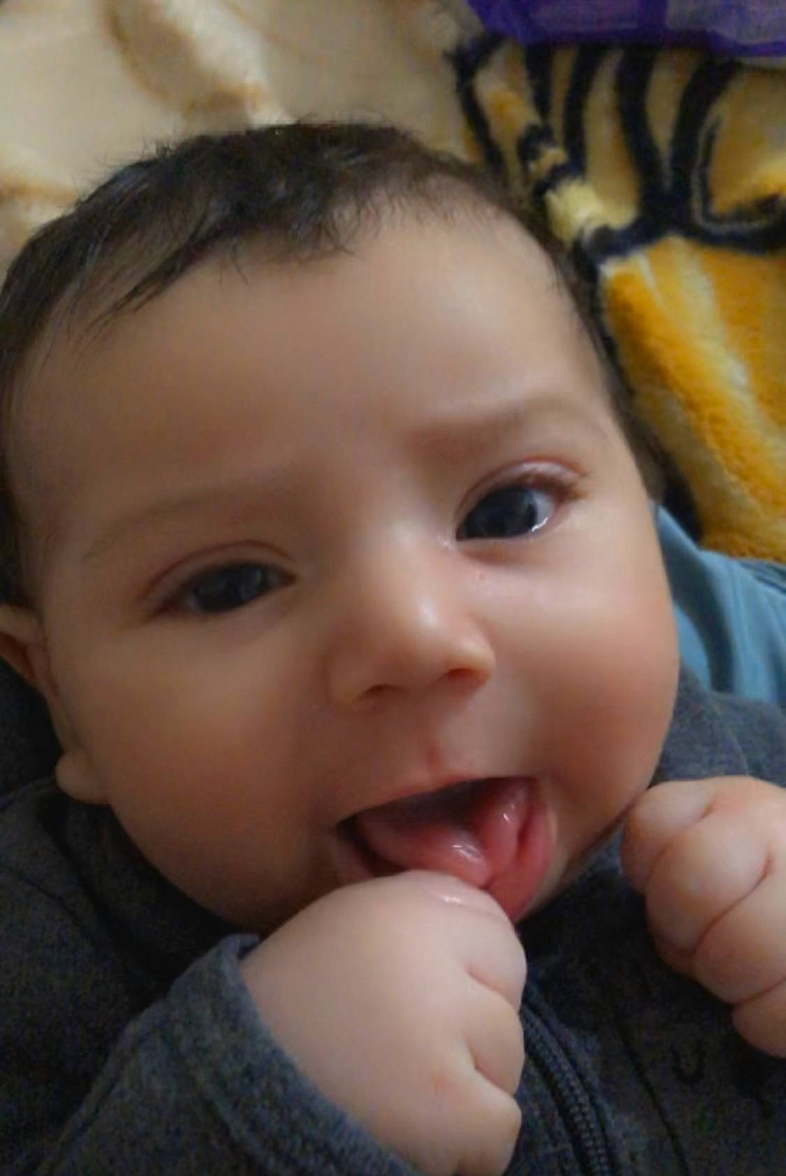 Octavio is registered to the contest to win money with this photo: baby, cheek, chin, ear, eye, eyebrow, eyelash, face, finger, forehead, gesture, happy, iris, lip, mouth, nose, organ, person, skin, thumb