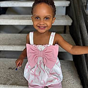 Viviana Rose joined the competition — help win amazing prizes! child, toddler, smile, face, pink_clothing, bow, pen, stairs, concrete, sitting, happy, person, portrait, short_hair, indoors, railing, cute, bright_eyes, casual_clothing, young_child