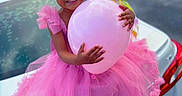 Viviana joined the competition — help win amazing prizes! child, girl, balloon, pink_dress, hair_bows, smiling, car_trunk, outdoor, daylight, white_shoes, tulle, happy, celebration, person, vehicle, colorful, cute, fashion, joyful, portrait