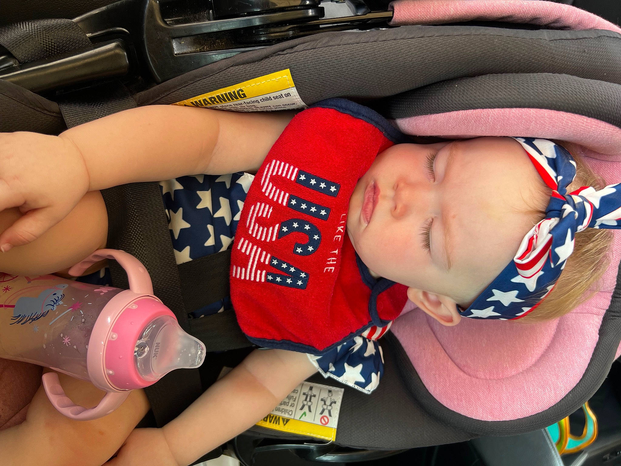 Madi joined the competition — help win amazing prizes! arm, baby, baby_carriage, baby_products, baby_toddler_clothing, carmine, child, comfort, drinkware, finger, fun, headwear, human_leg, mouth, nail, person, plastic_bottle, skin, thigh, thumb