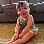 baby, babylaughing, blonde, clothing, couch, cushion, face, furniture, hair, happy, head, homedecor, person, photography, portrait, shorts, sitting, sleeve, smile, standing