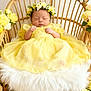 Ivy-Mai is registered to the contest to win money with this photo: baby, sleeping, yellow_dress, floral_crown, wicker_chair, flowers, butterflies, cushion, soft_texture, newborn, peaceful, indoor, portrait, decor, pastel_colors, tulle_skirt, headwear, cute, infant, resting