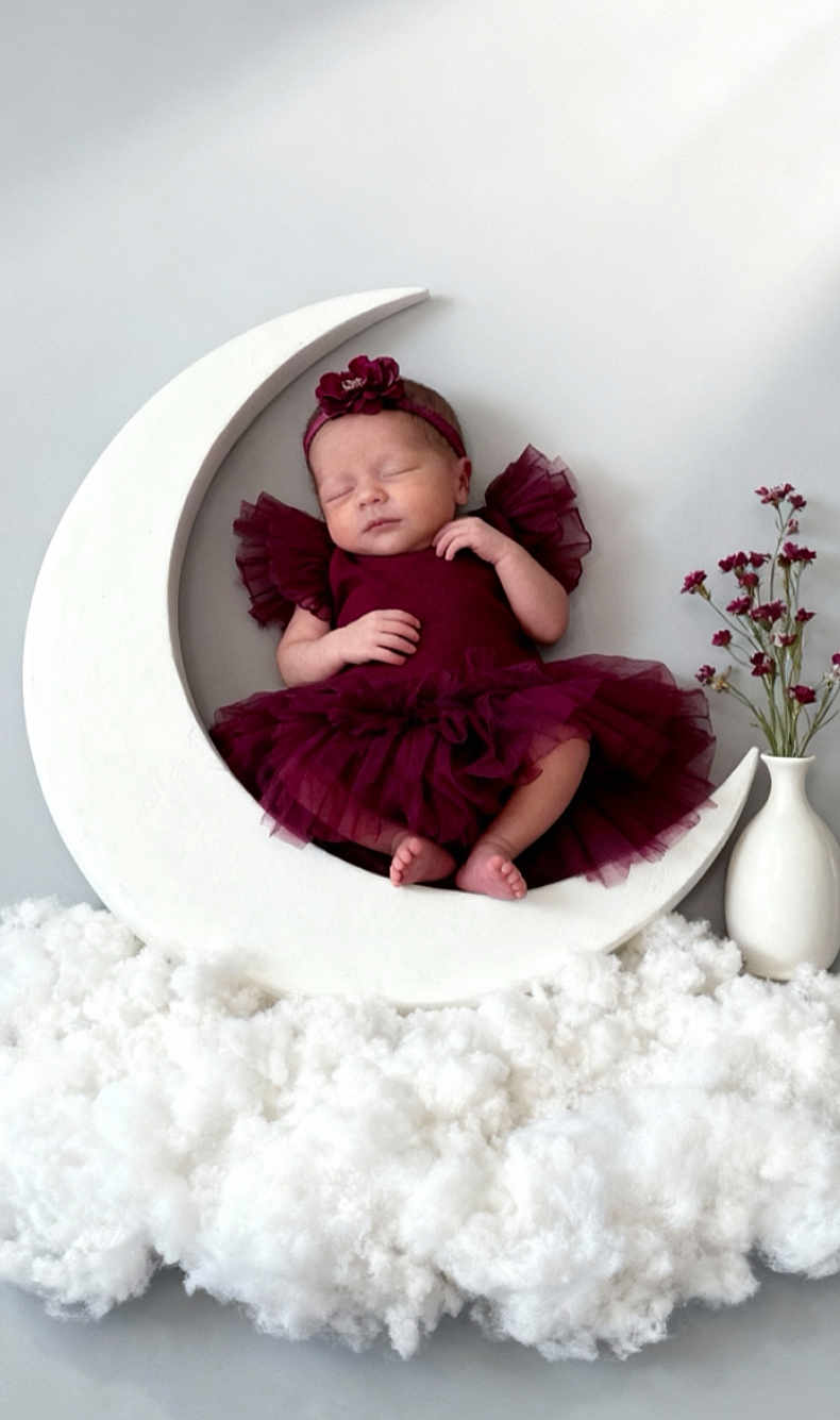 Ivy-Mai is registered to the contest to win money with this photo: newborn, baby, sleeping, dress, headband, crescent_moon, clouds, vase, flowers, tutu, indoor, studio, portrait, infant, soft_lighting, decor, props, peaceful, cute, resting