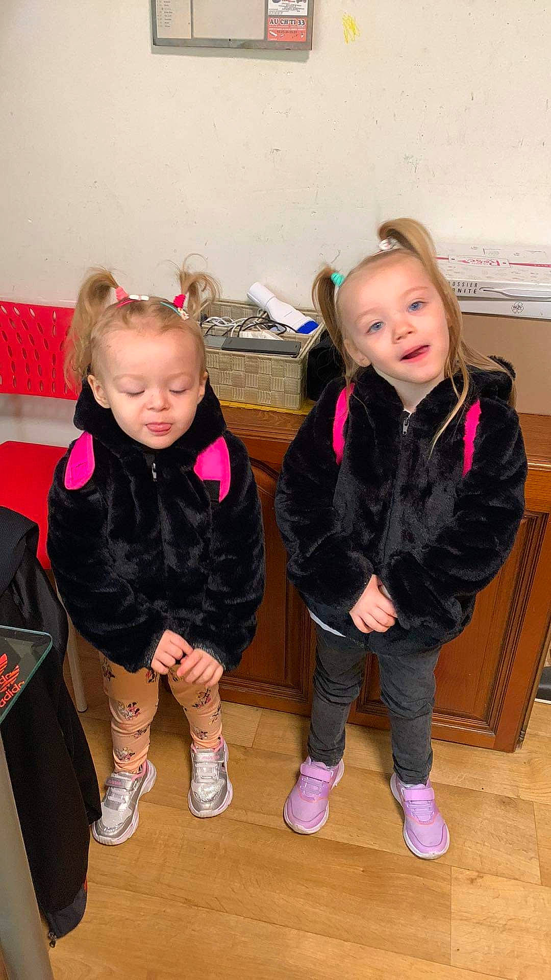 Marie Noella participe au concours pour gagner de l'argent avec cette photo : baby_toddler_clothing, boot, chair, child, event, floor, flooring, fun, happy, jacket, leg, leisure, person, pink, shoe, sitting, skin, smile, sneakers, sock