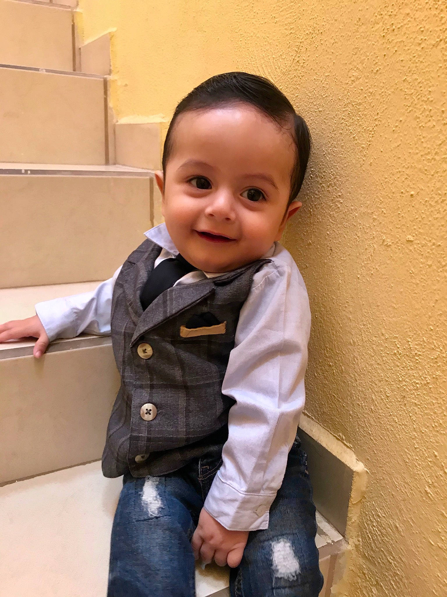 Martín is registered to the contest to win money with this photo: baby, cheek, child, child_model, jacket, joy, outerwear, person, sitting, skin, smile, standing, toddler