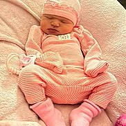 Emberley Hughes joined the competition — help win amazing prizes! baby, blanket, child, closed_eyes, cozy, face, hat, indoors, infant, lying_down, newborn, peaceful, pink, plush_toy, portrait, sleeping, socks, soft_lighting, striped_outfit, textile