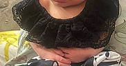 Emberley Hughes is registered to the contest to win money with this photo: newborn, baby, infant, sleeping, face, portrait, sitting, black_lace, collar, polka_dot, outfit, bare_feet, toes, hands, closed_eyes, pout, cushion, blanket, indoor, close_up