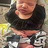 newborn, baby, infant, sleeping, face, portrait, sitting, black_lace, collar, polka_dot, outfit, bare_feet, toes, hands, closed_eyes, pout, cushion, blanket, indoor, close_up