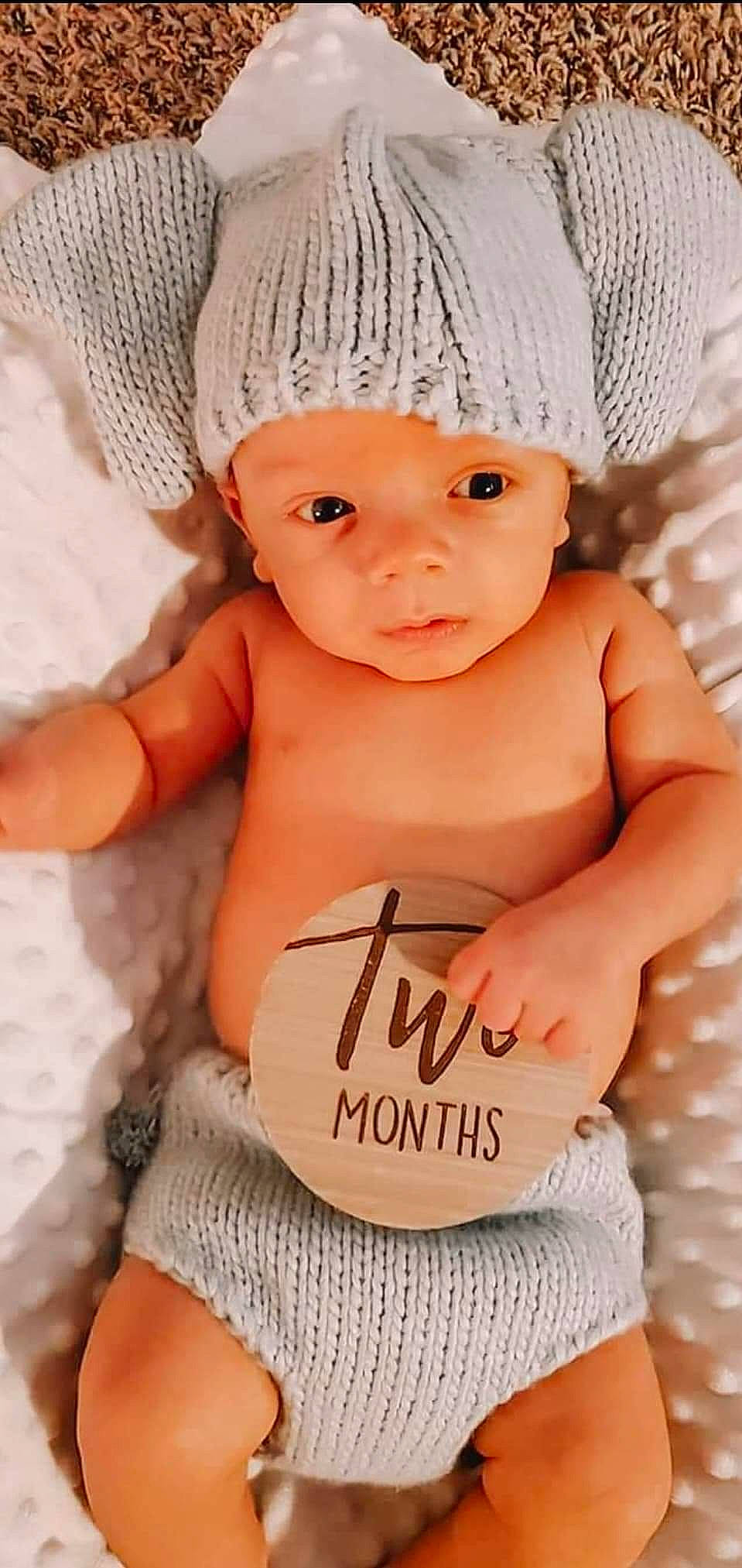 Braylen is registered to the contest to win money with this photo: abdomen, baby, baby_toddler_clothing, cap, cheek, chest, child, eyebrow, facial_expression, finger, flash_photography, hairstyle, happy, headwear, lip, person, pink, skin, stomach, thumb