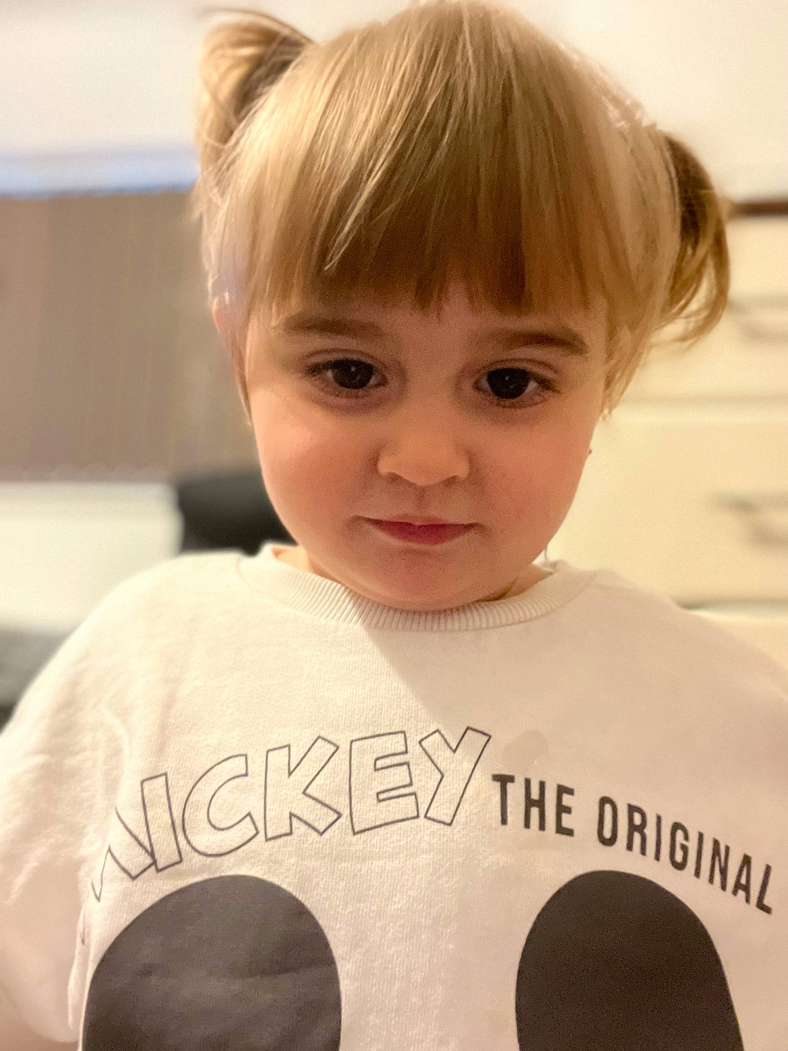 Aylin is registered to the contest to win money with this photo: audio_equipment, bangs, brown_hair, cheek, child, cool, eyelash, facial_expression, forehead, fun, handwriting, happy, mammal, nose, people, person, sleeve, smile, t_shirt, toddler