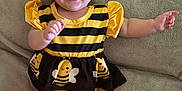 Kynslee joined the competition — help win amazing prizes! baby, child, infant, yellow, black, headband, bow, smile, happy, cute, lying_down, blanket, clothing, costume, bee, striped, pants, sleeves, feet, expression