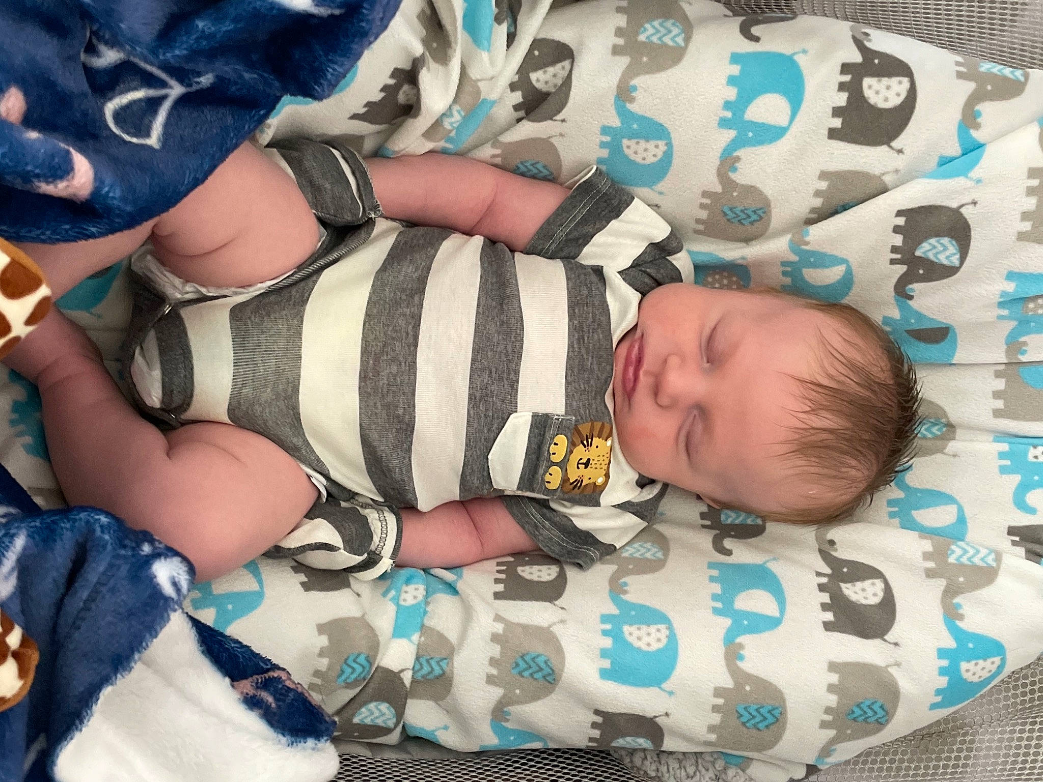 Reece joined the competition — help win amazing prizes! arm, baby, baby_products, baby_sleeping, baby_toddler_clothing, blue, child, comfort, electric_blue, finger, happy, human_leg, linens, nail, pattern, person, sleeve, sock, textile, thigh