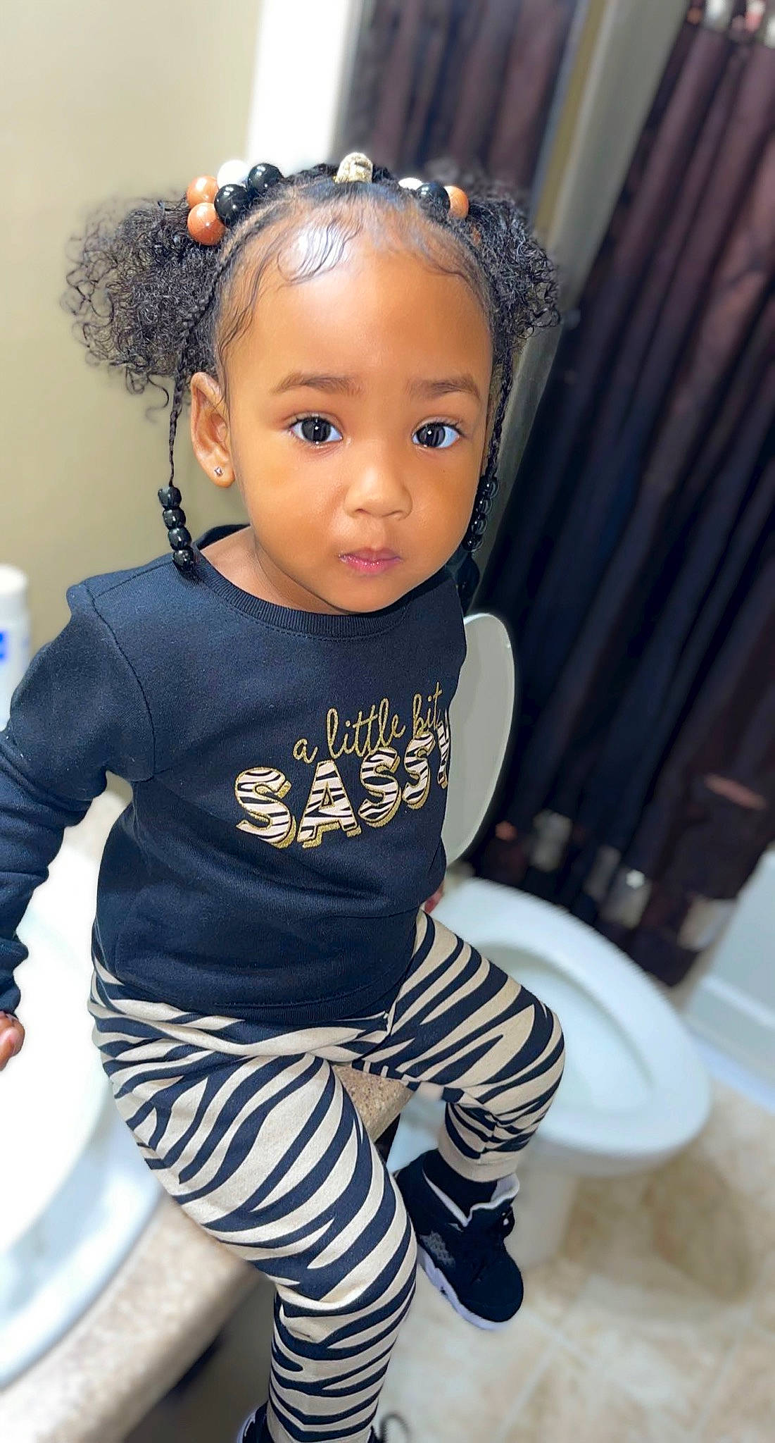 Raina is registered to the contest to win money with this photo: baby_toddler_clothing, black, black_hair, cheek, child, cool, electric_blue, eyelash, face, fashion_design, flash_photography, hair, headband, headpiece, jewellery, neck, person, sleeve, t_shirt, toddler