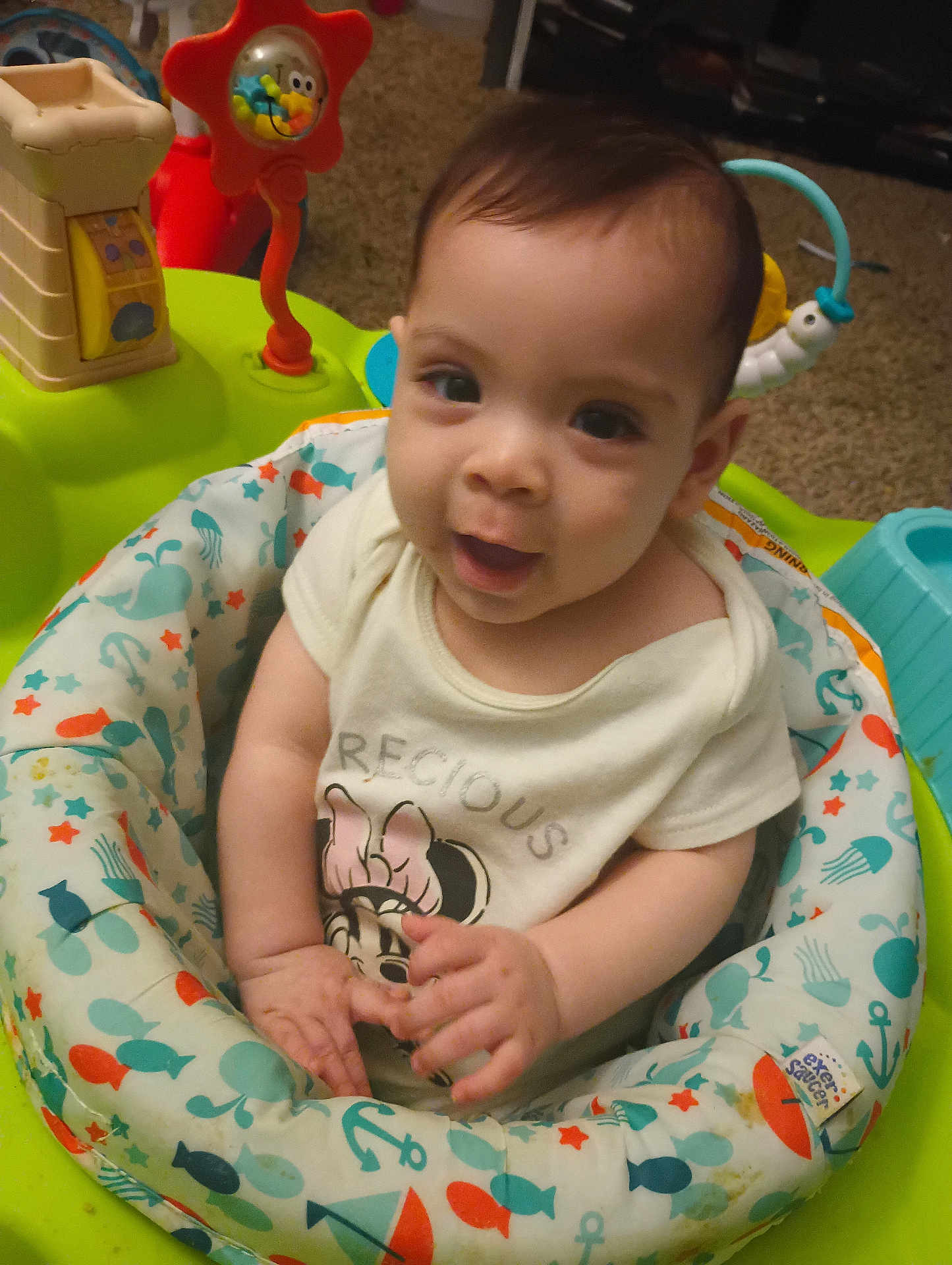 Halle joined the competition — help win amazing prizes! baby, child, infant, smiling, seat, baby_seat, toys, colorful, clothing, cute, face, hands, indoor, carpet, playtime, expression, person, young, happy, mickey_mouse